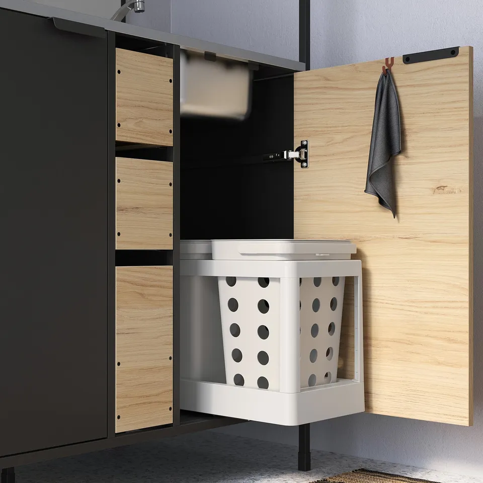 Kitchen cabinet with pull-out bins for waste sorting, ash-effect doors, and adjustable feet.