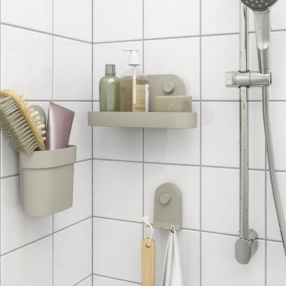 ÖBONÄS bathroom storage: shelf, hooks for toiletries and brush.