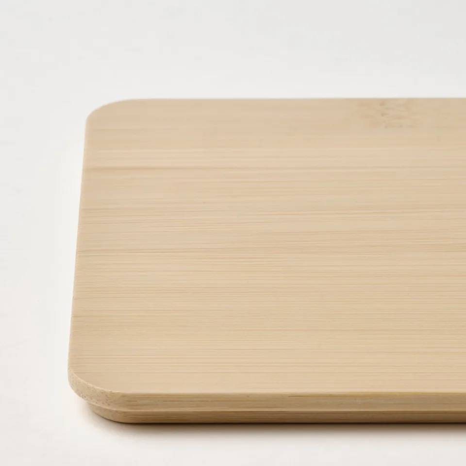 Smooth, light-colored bamboo lid showing fine grain texture and quality craftsmanship.
