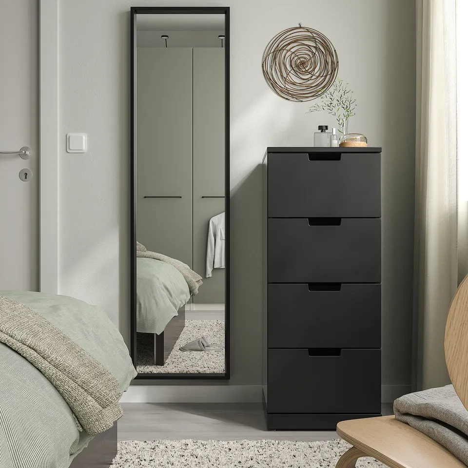 Modern bedroom with NISSEDAL mirror & drawer unit. Reflects bed, creates spacious, sleek look.