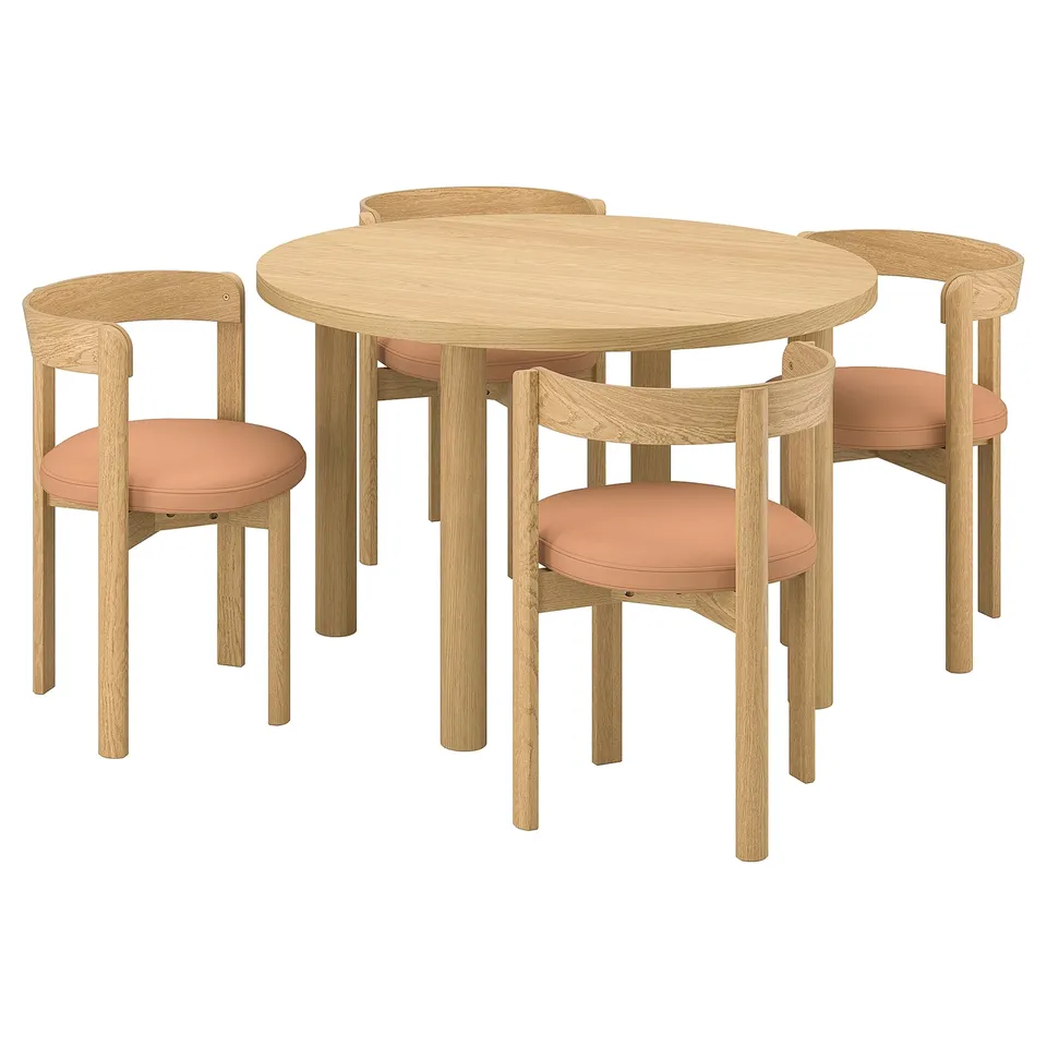 The stockholm dining set in light oak and orange. It includes a round table and four chairs with a modern scandinavian design.