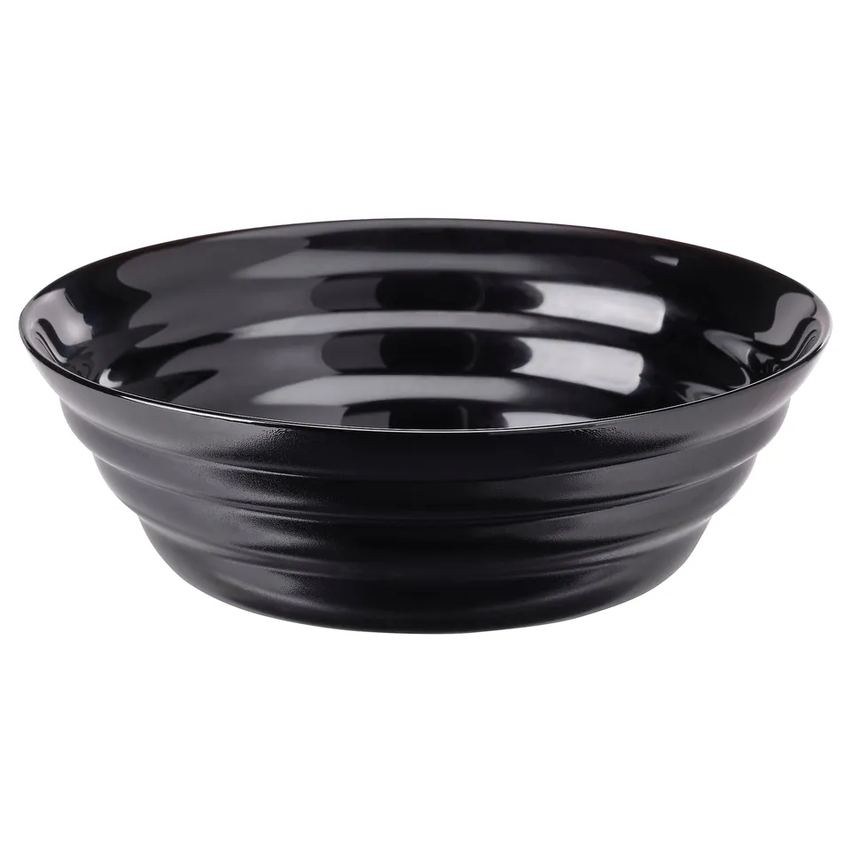 A black, round, tempered glass bowl with a glossy finish, featuring a ripple pattern design.