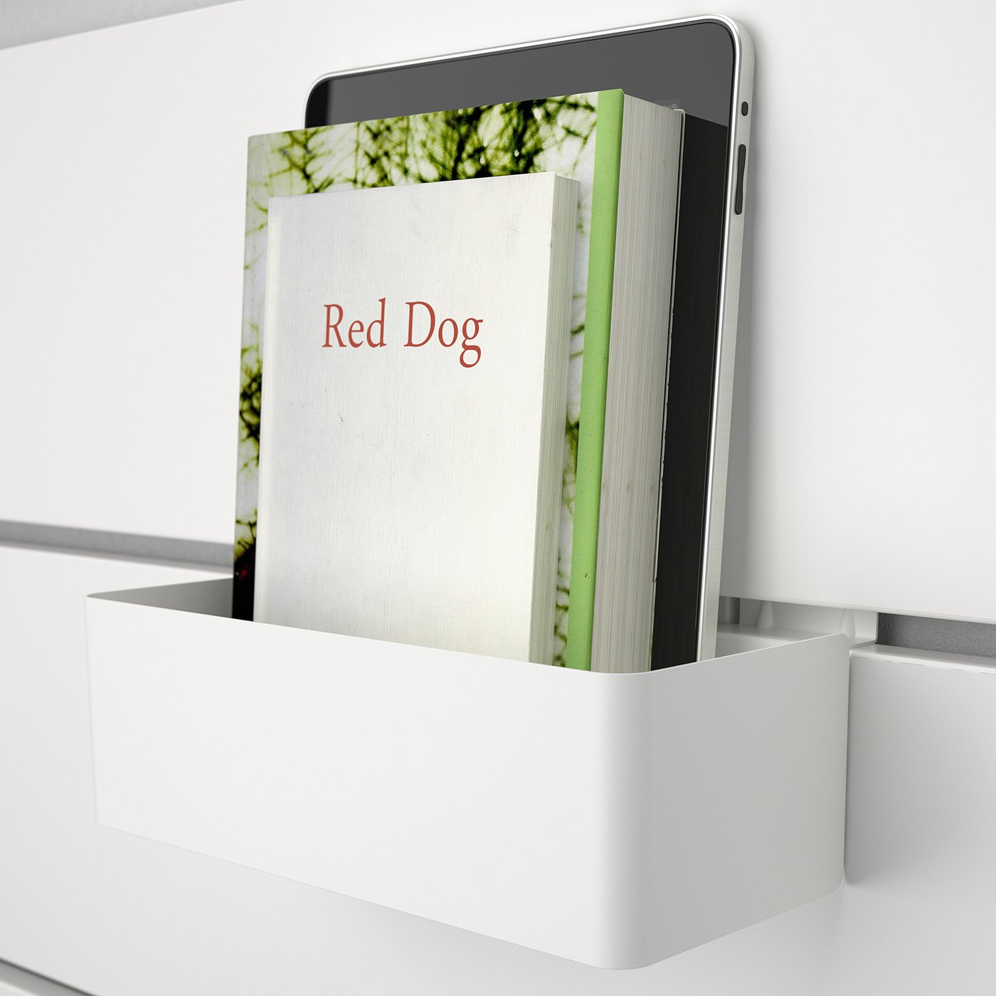 A tablet and book titled red dog sit in a white wall-mounted organiser, demonstrating a storage and display solution for bedrooms.