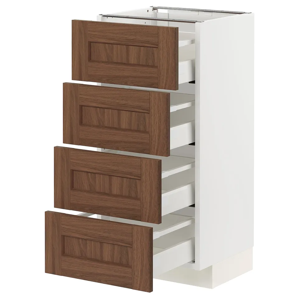 A white METOD kitchen cabinet with four wooden drawers.