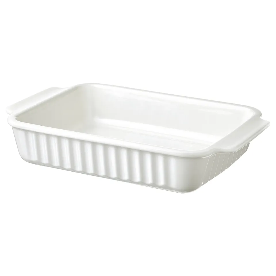 A white POETISK baking dish made of stoneware, rectangular with handles and ribbed design.