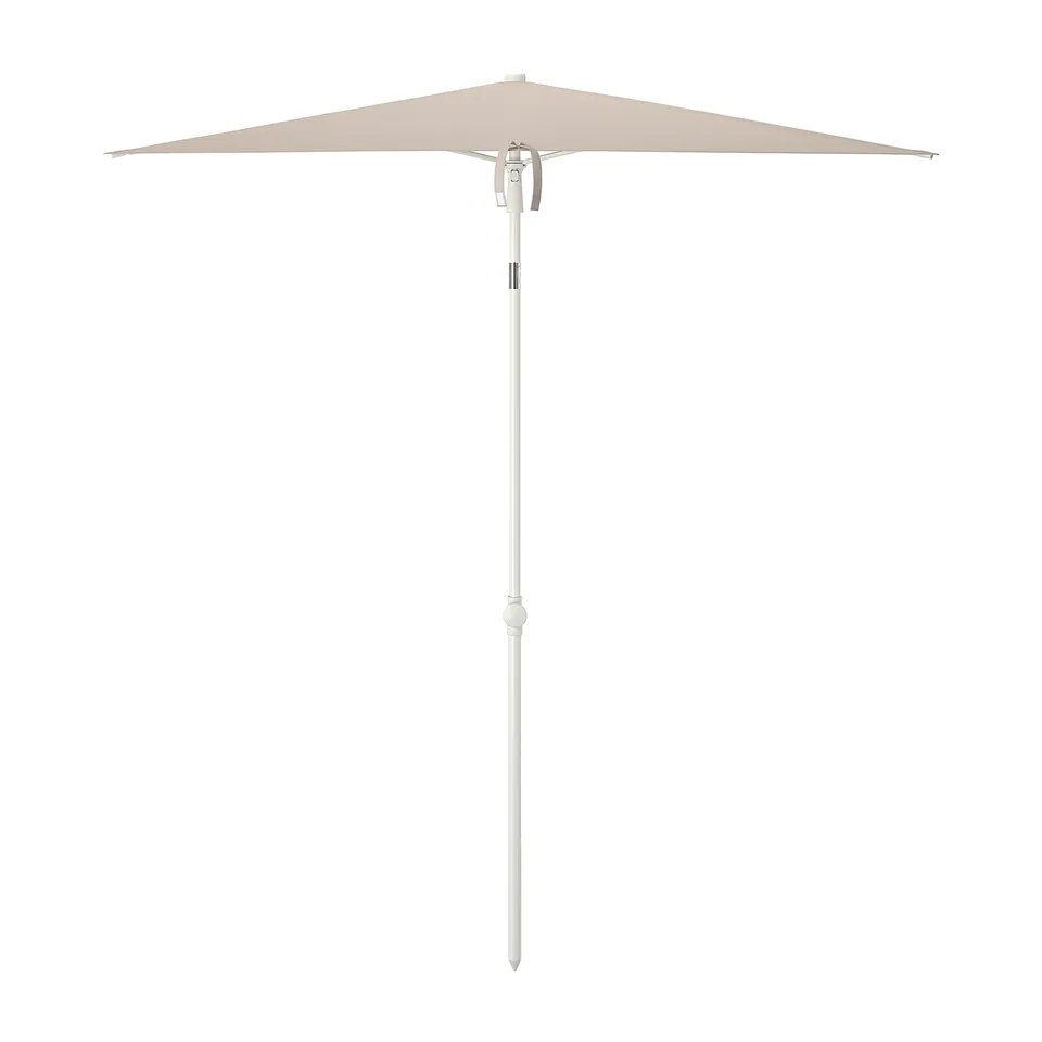 A TVETÖ cream-colored sun parasol with adjustable tilting, designed for outdoor use, featuring a white handle and stem.