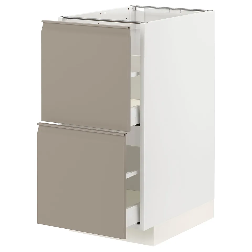 A modern, beige ikea METOD kitchen cabinet with integrated handles, featuring smooth-running drawers.