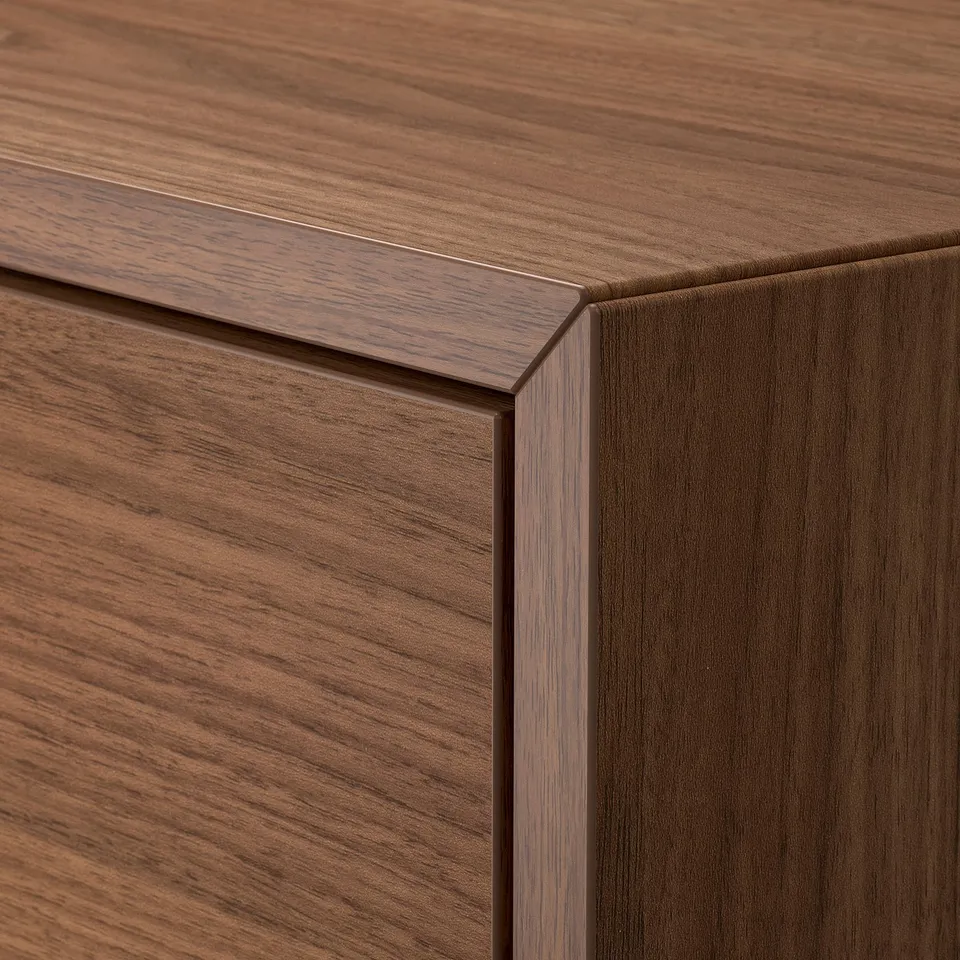 Wooden furniture detail. Craftsmanship with smooth, dark finish and clean lines.