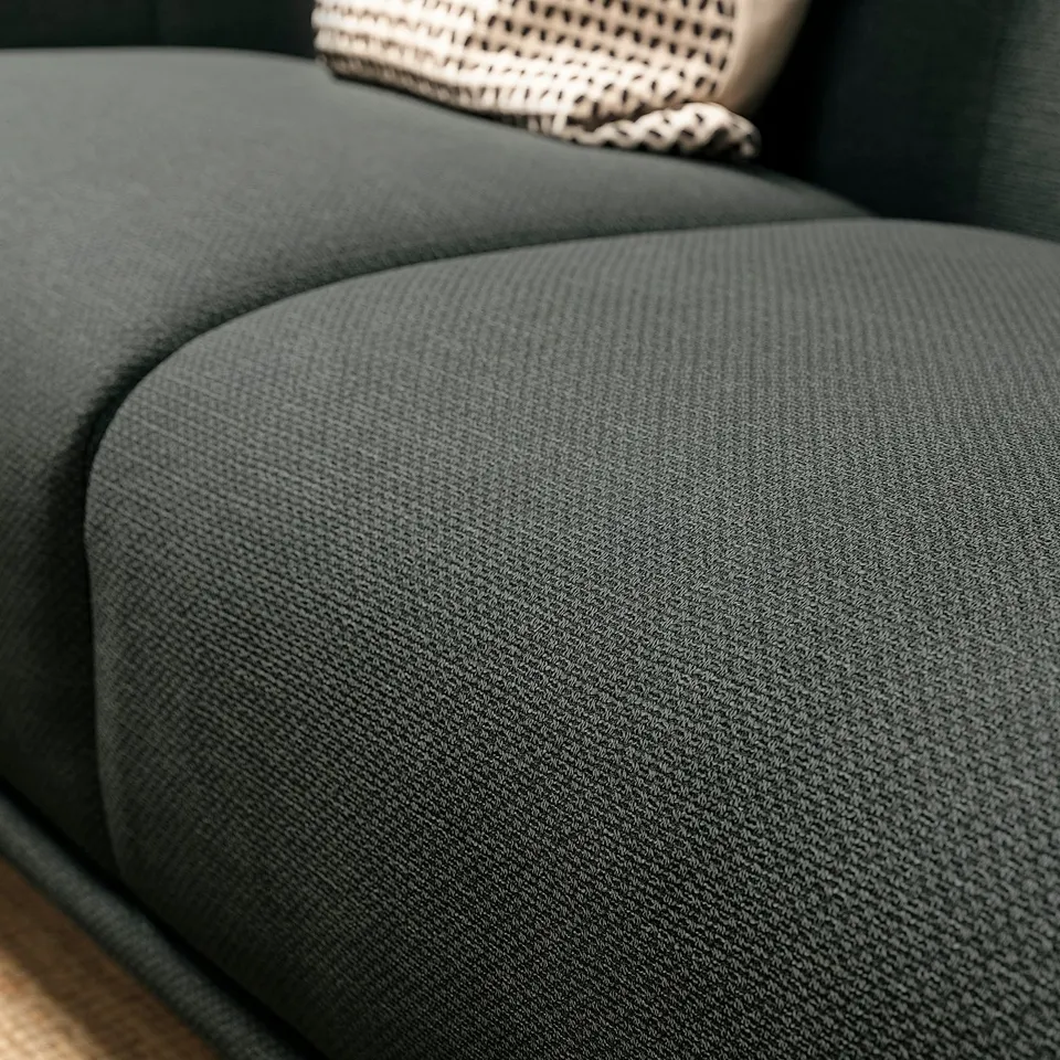 Dark grey VISKAFORS sofa close-up, soft rounded seat, dense fabric texture.