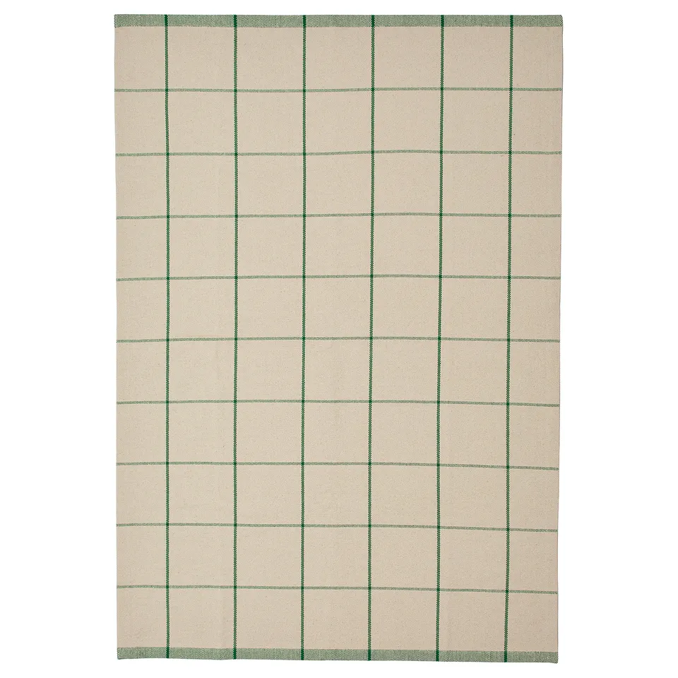Off-white & green chequered cotton rug with flatweave design, suitable for dining area.