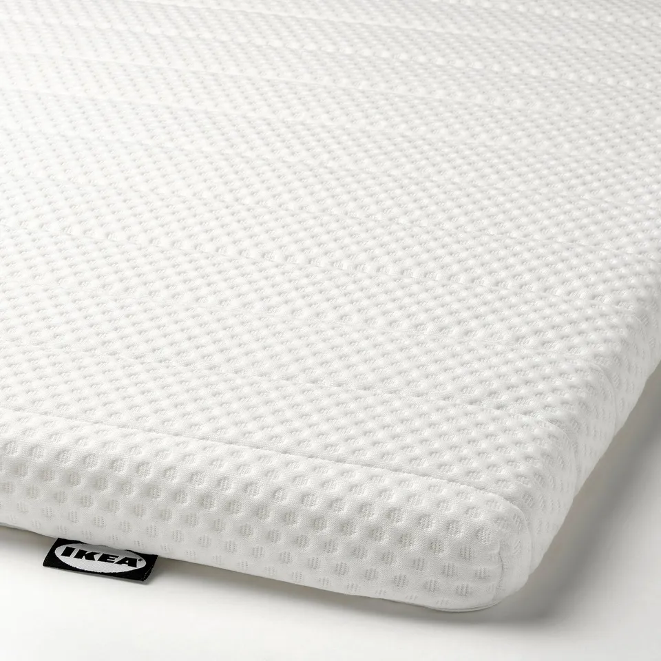 Ikea mattress pad, high resilience foam for firmer sleep, 5 cm thick, machine washable cover.