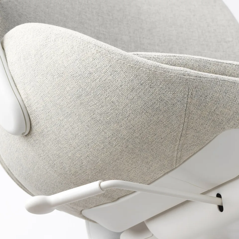 Chic, ergonomic office chair in white, featuring soft, textured fabric and sleek, white armrests for comfort and style.
