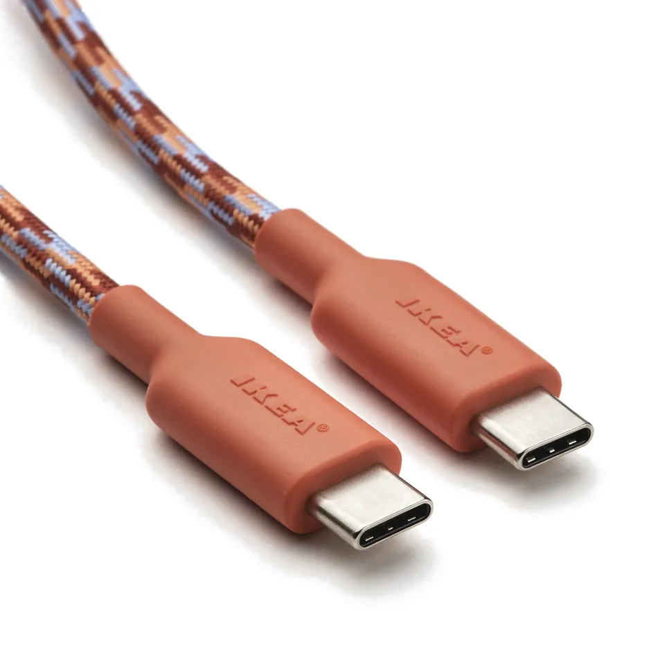 Two usb-c charging cables in rust red with textured design, branded liki. They are displayed neatly against a light background.