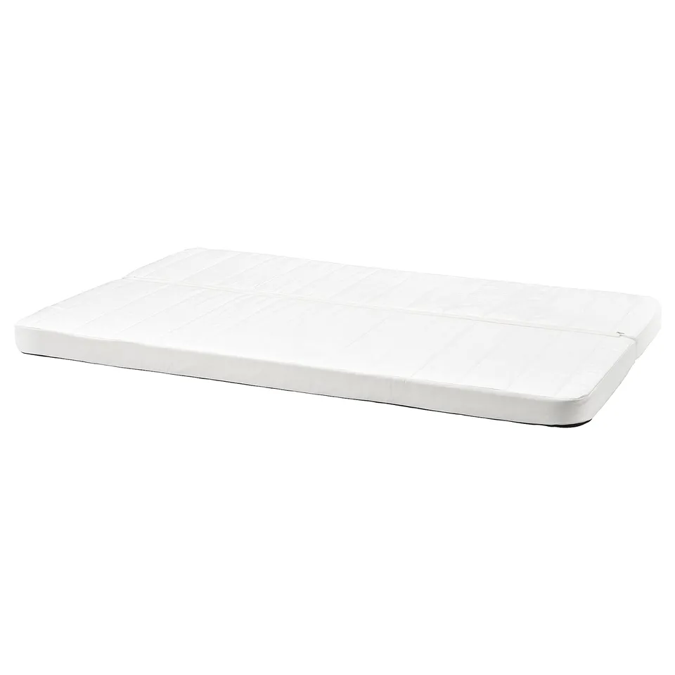 A white NYHAMN foam mattress, rectangular, with a smooth surface and removable cover for machine washing.