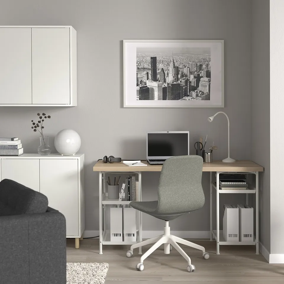 Compact home office with LAGKAPTEN desk, adjustable chair, monitor, and storage, perfect for small spaces.