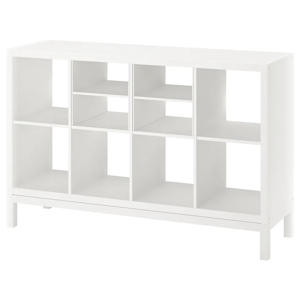 White ikea KALLAX shelving unit with open compartments.