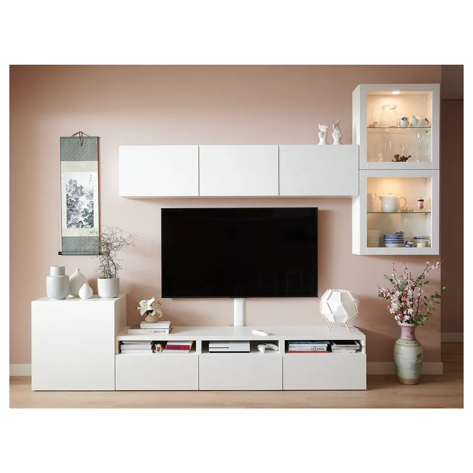 Modern living room with BESTÅ tv unit, flat screen, decor, and wooden floors.