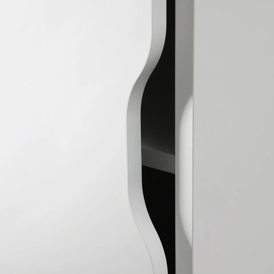 Sleek white wall-mounted shelf with smooth edges, providing modern storage space.