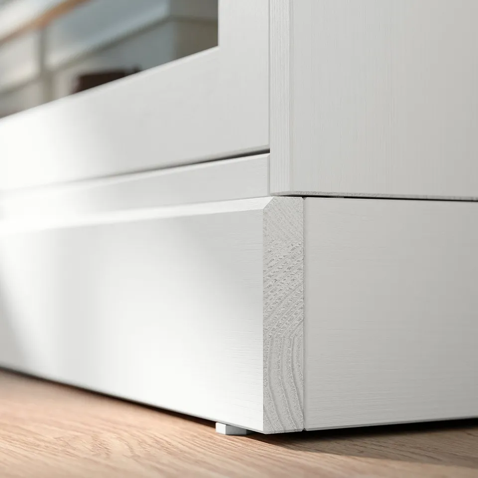 White wooden tv stand with sleek edges and glass doors, minimalist design.