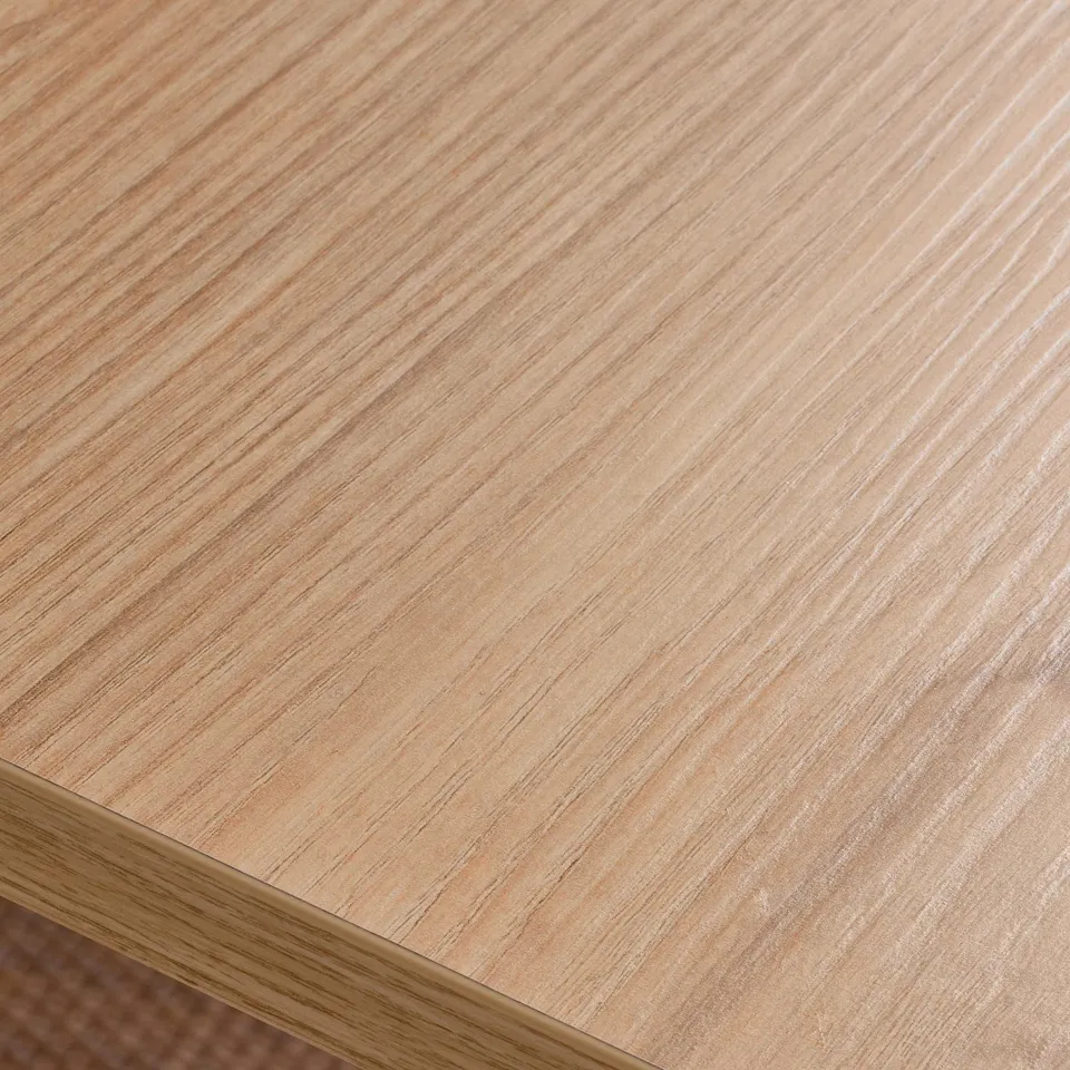 Wooden desk surface, finely textured with visible grain, smooth and polished finish.