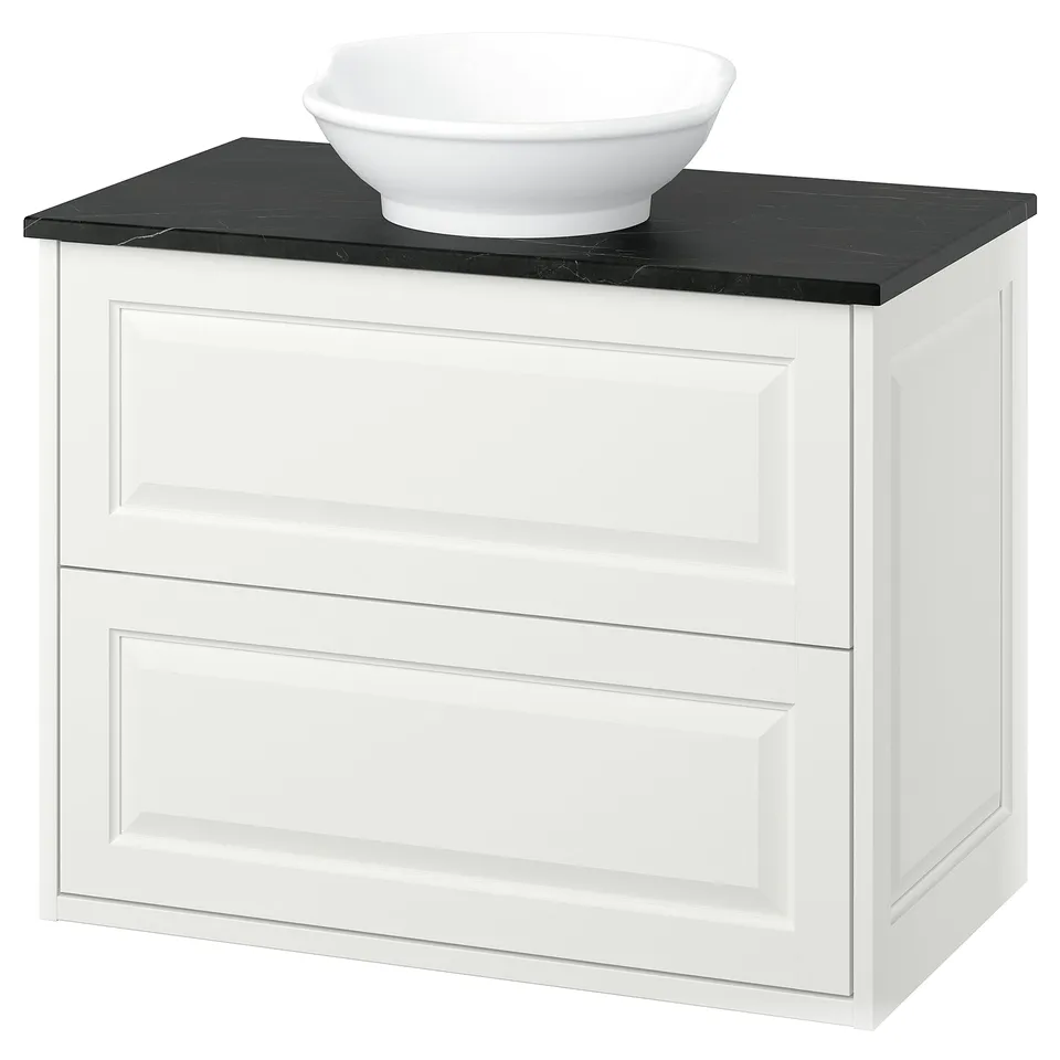 White TÄNNFORSEN cabinet, black marble top, round sink, classic design.
