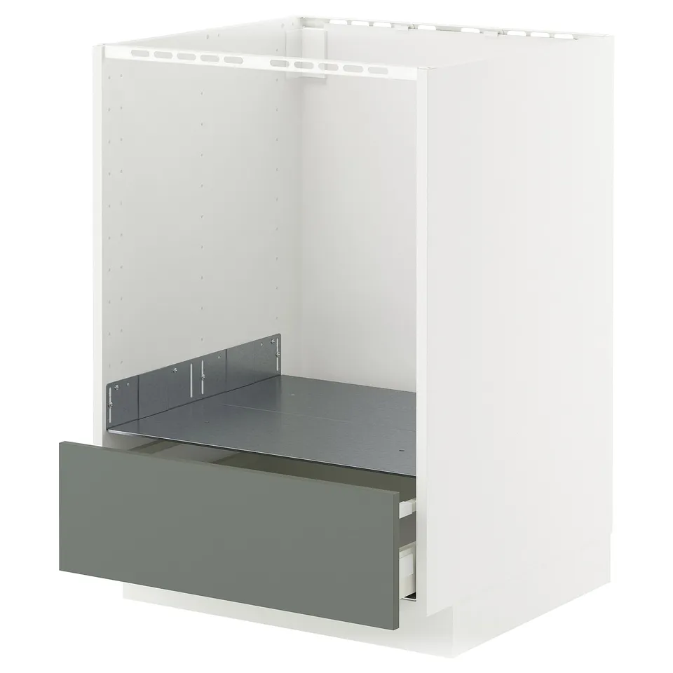 White METOD kitchen cabinet with grey-green drawer.