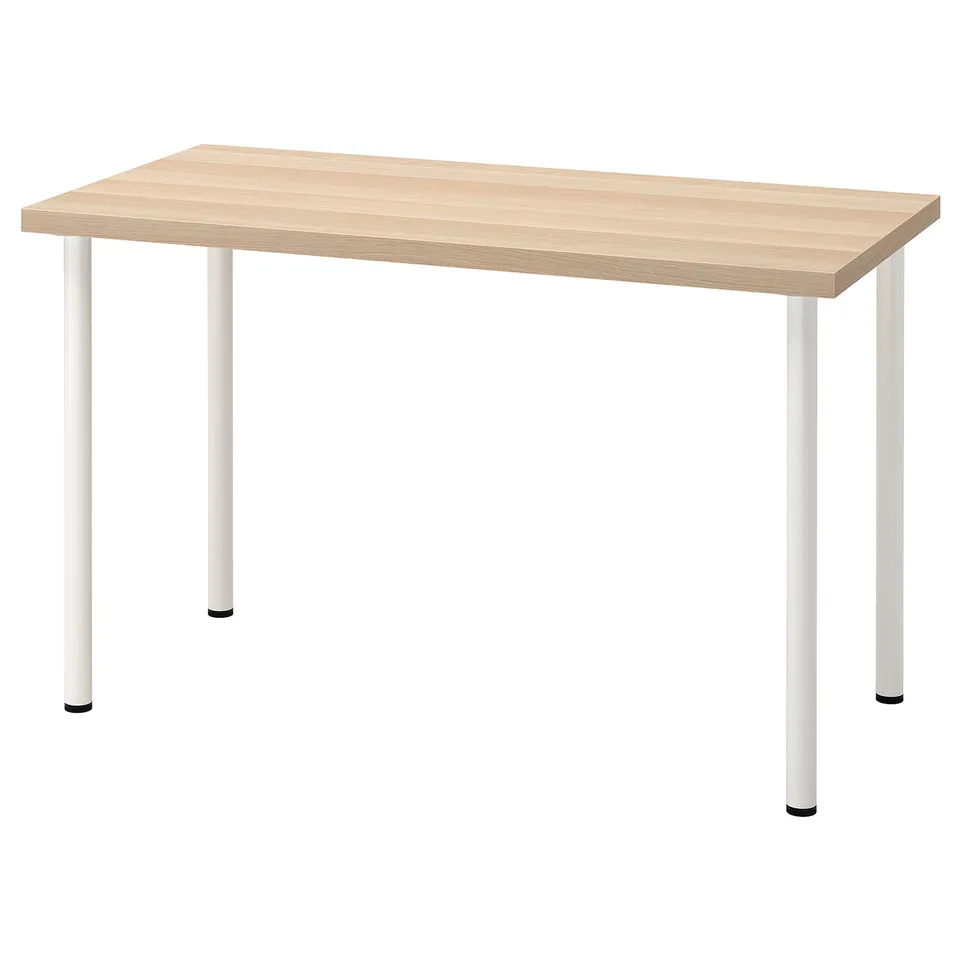A light wooden desk with white metal legs.