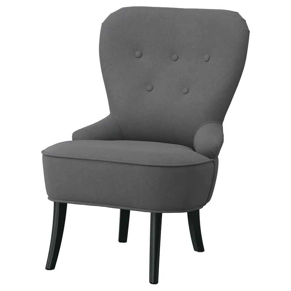 REMSTA grey fabric armchair, softly rounded corners, dark wooden legs.