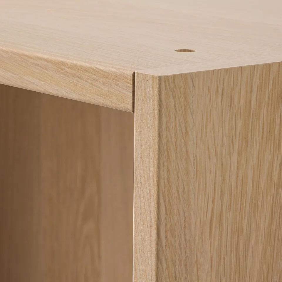 Close-up of smooth, well-crafted wooden furniture with fine grain texture, showcasing quality materials and precise construction.