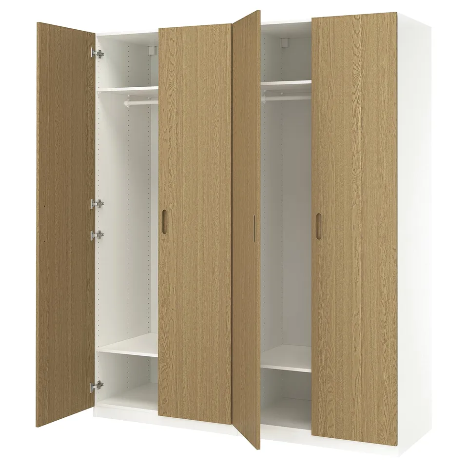 Wooden PAX wardrobe with four doors open, light-brown finish, made from particle board and veneer, rectangular shape, simple design.