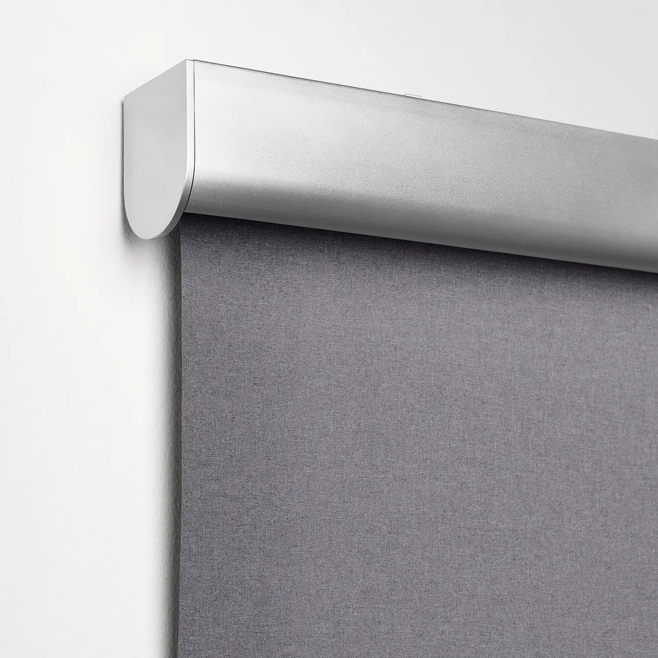 Close-up of cordless, light-blocking roller blind with soft-close feature.