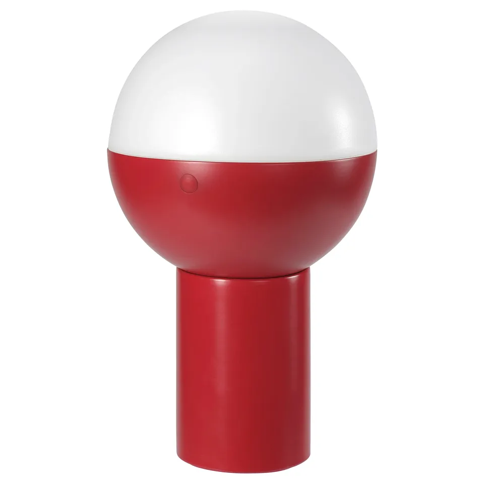 Red and white spherical table lamp with cylindrical base.