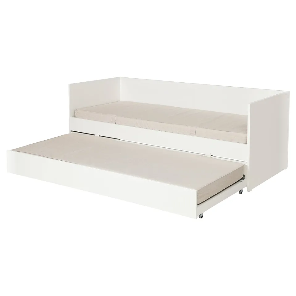 A white VIHALS daybed with a trundle bed. Modern and sleek, its made from particleboard and a clean, minimalist design with a pull-out trundle.