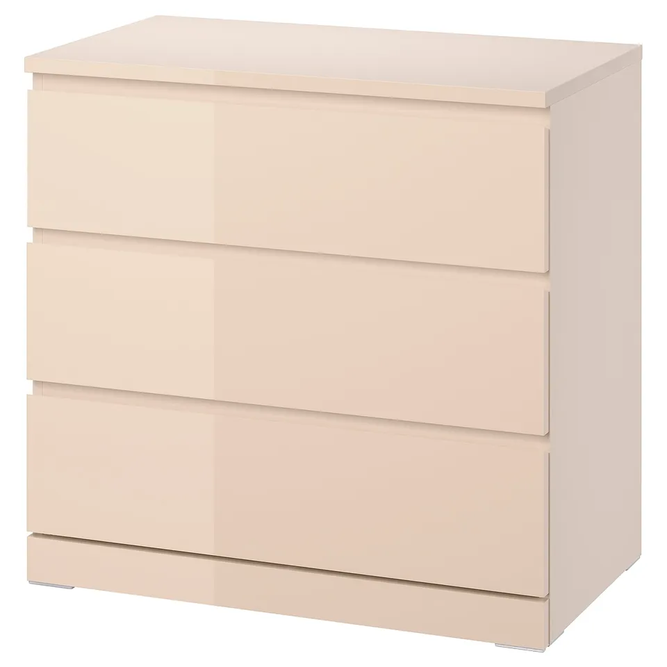 Light orange MALM chest of drawers; sleek, rectangular design with three wide drawers, smooth finish.