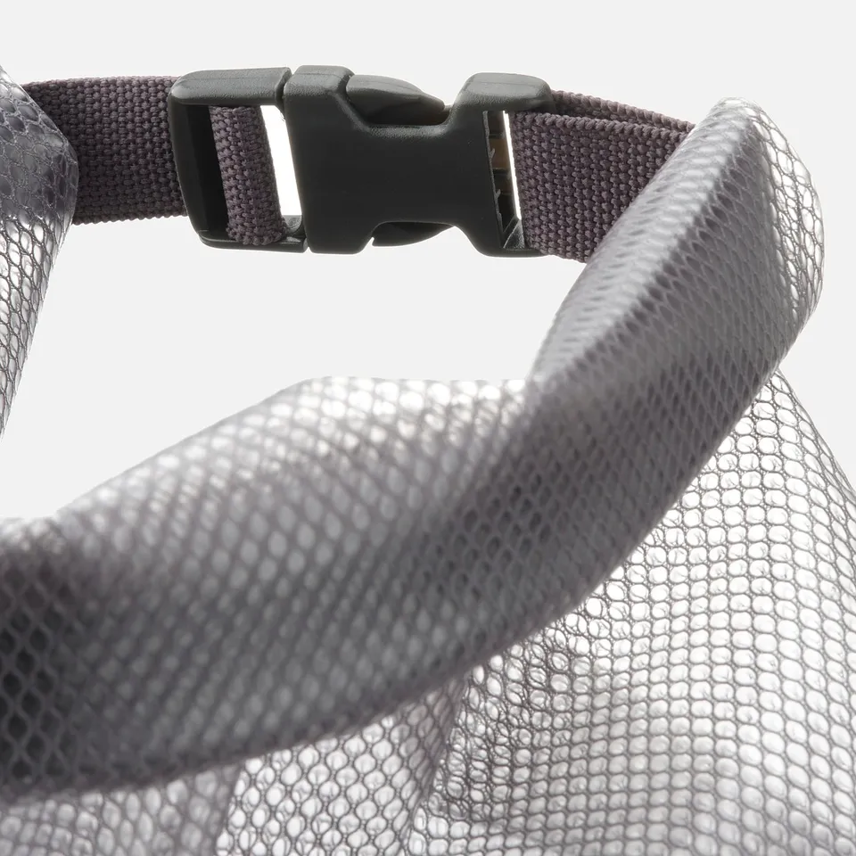 Close-up of a durable mesh bag strap with a secure plastic buckle.