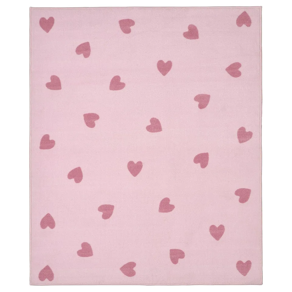 Pink heart-patterned rug, soft, recycled polyester, rectangular, snug feel.