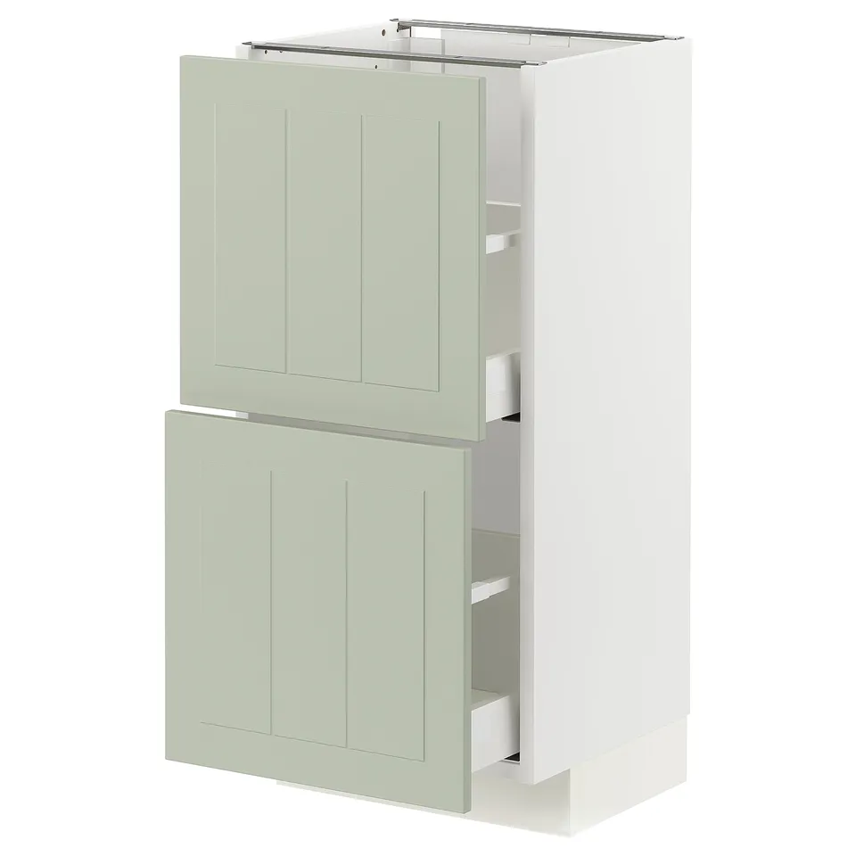 White and green kitchen cabinet with two drawers and two doors, modern design.