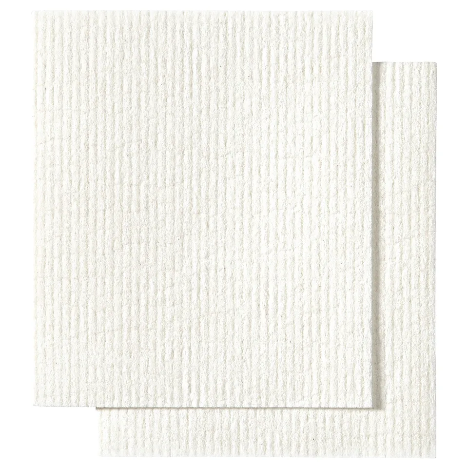 Two white TRIXIG cleaning cloths made of cellulose and cotton, rectangular in shape, perfect for various household cleaning tasks.