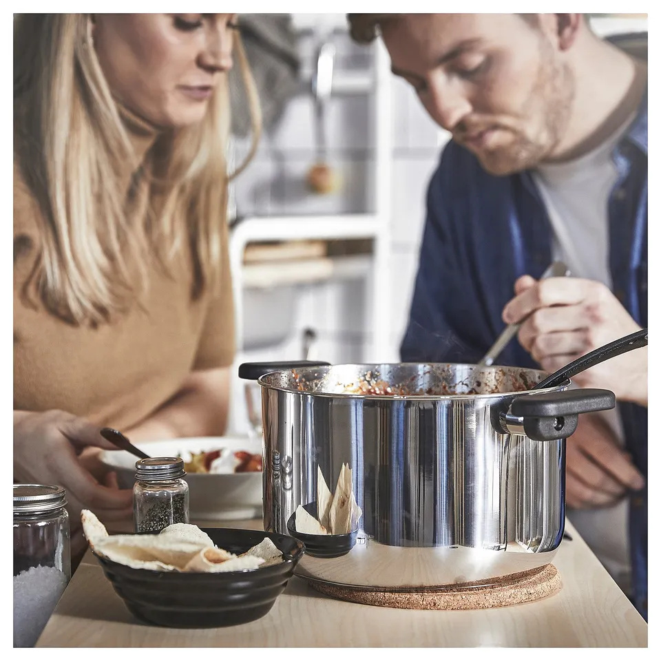 Couple cooking in kitchen.
