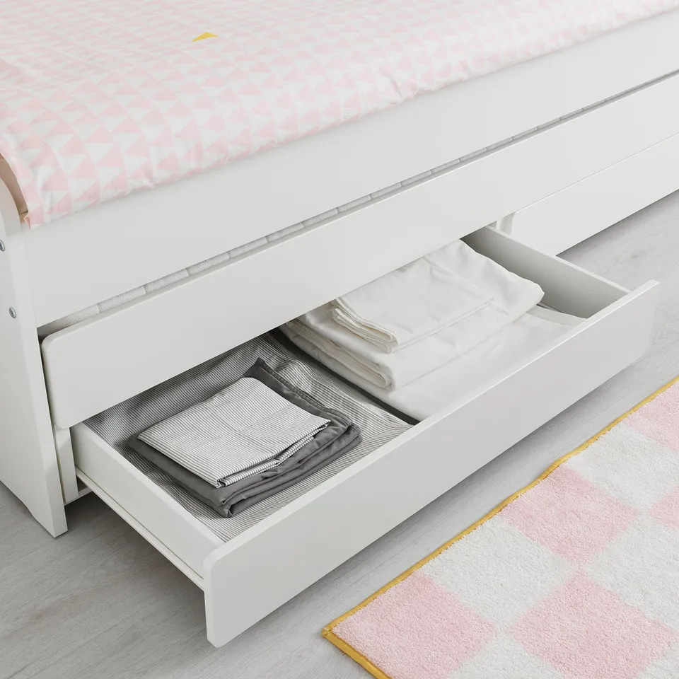 Under-bed storage with folded linens. Two drawers, fits under SLÄKT bed frame.