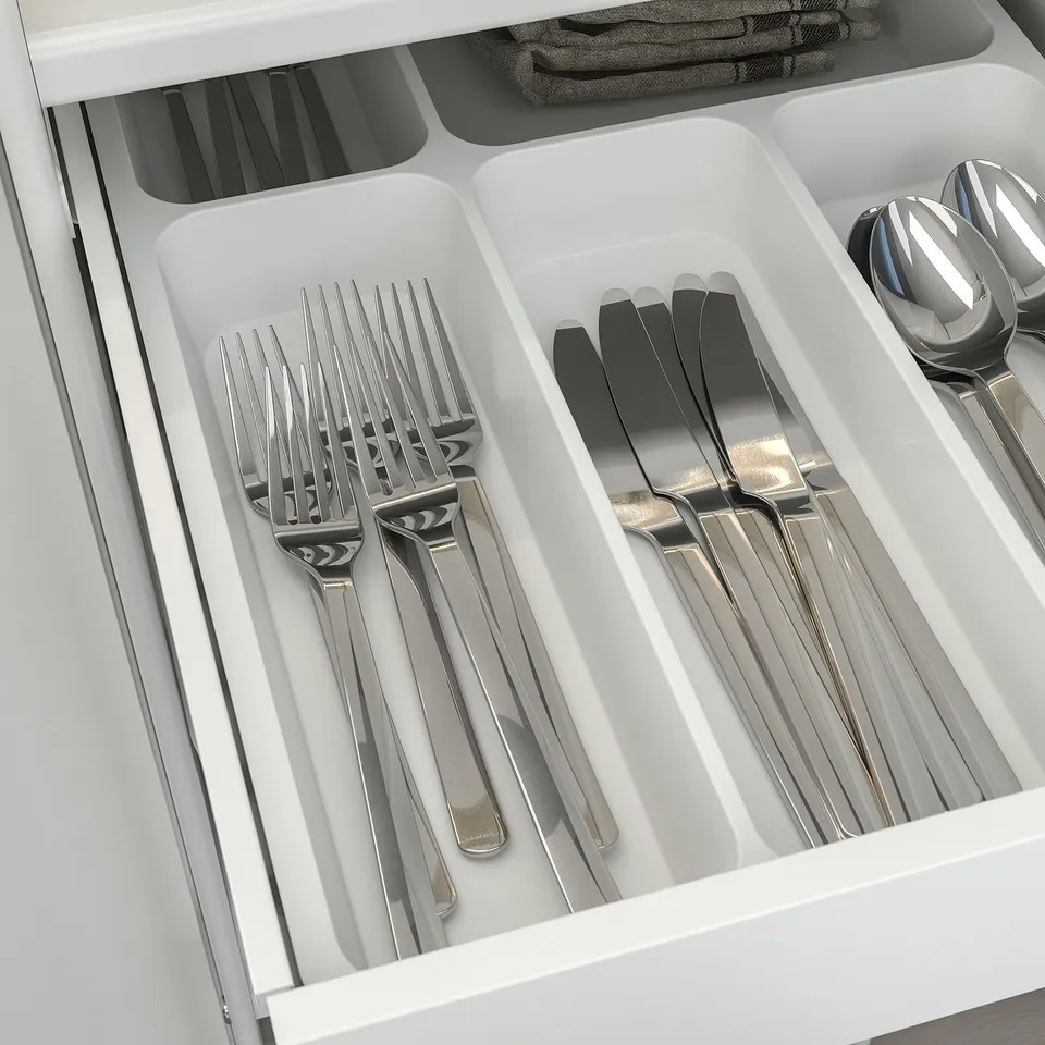 Silverware organiser: forks, knives, spoons in sections.