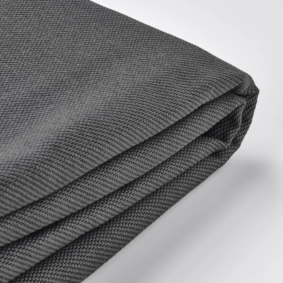 Close-up of soft, textured fabric sofa cushion; shows design and quality.