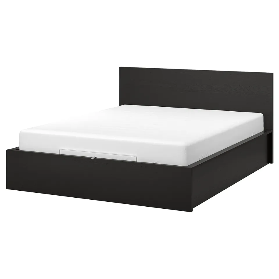 Minimalist black wooden bed, MALM, with under-storage, high headboard, and white mattress, sleek design for modern rooms.