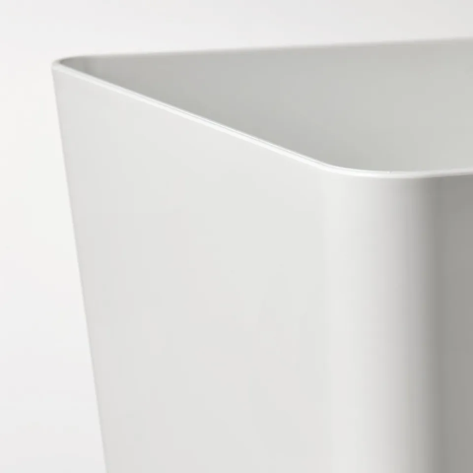 Close-up of sleek, white KUGGIS storage box, smooth edge detail, high-quality finish.