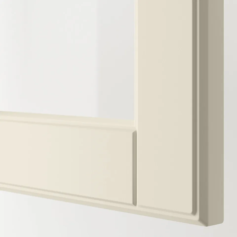 Clean, off-white cabinet corner with smooth, bevelled edges. Glass panel visible.