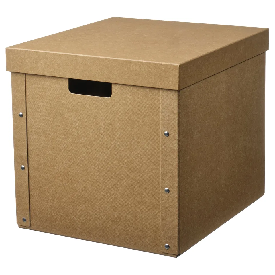 A brown GÄRDESGÅRD storage box. Made from recycled paper and paperboard, it a lid and handle. The box is square-shaped with a simple design.