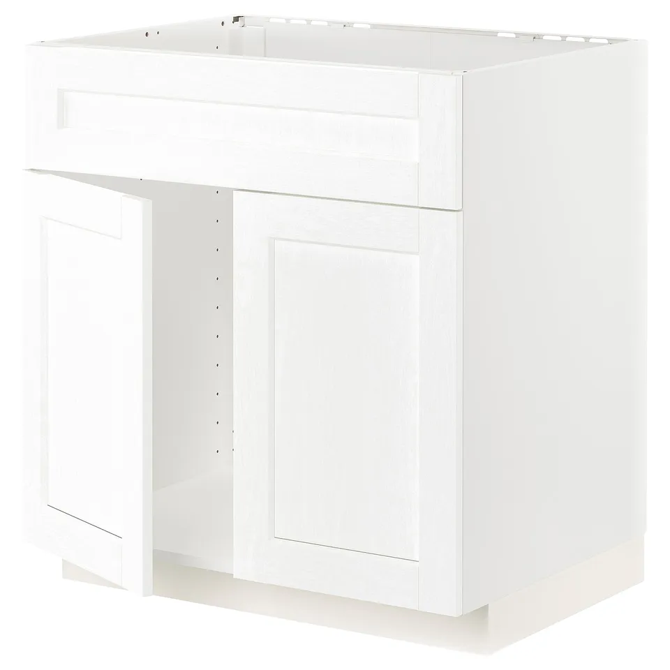 A white kitchen cabinet from the METOD system. It has a modern design with smooth surfaces and simple lines.