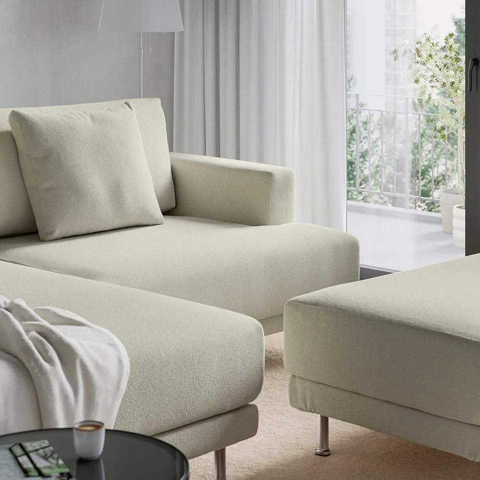 Modern cream-sectional sofa with large cushions and metal legs for airy look and easy cleaning.