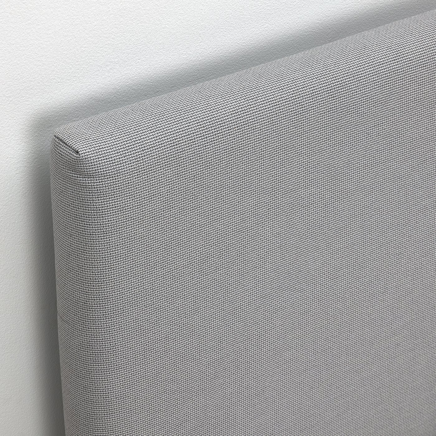 Modern grey upholstered bed with soft padded headboard; clean, sleek design.