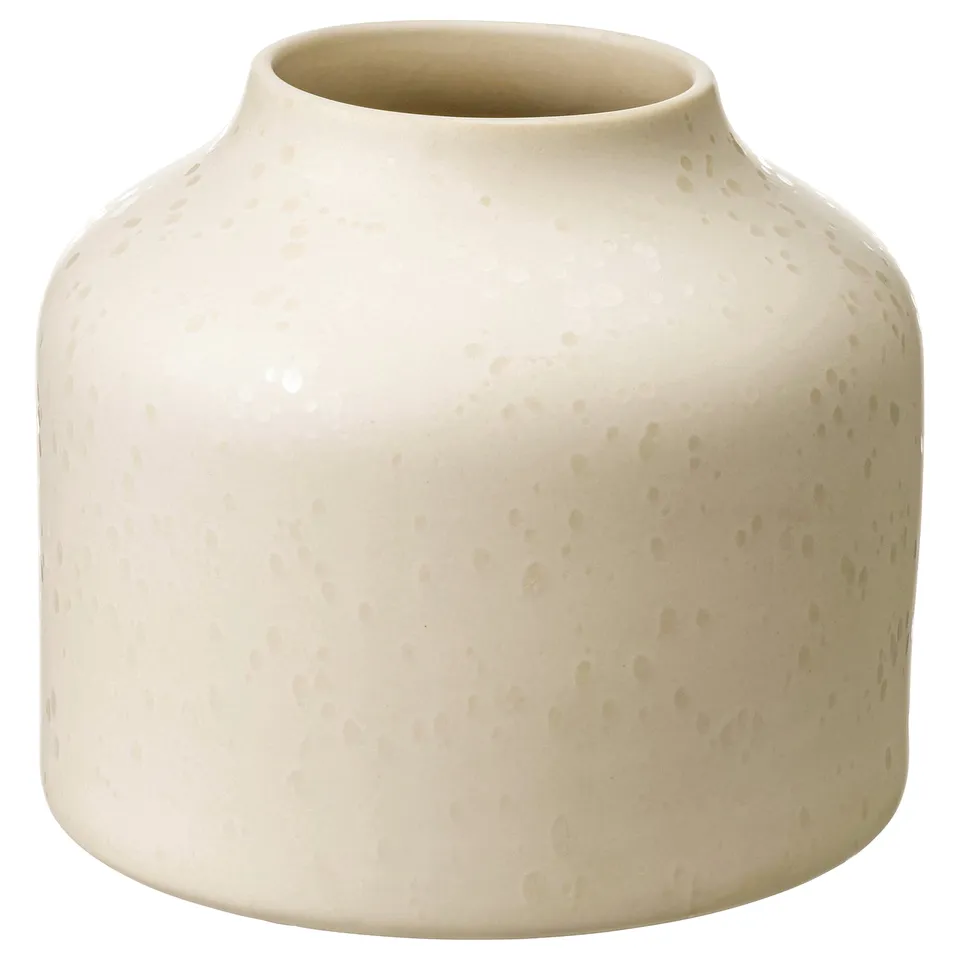 Unique white ceramic vase, dotted design, wide opening, tactile finish.